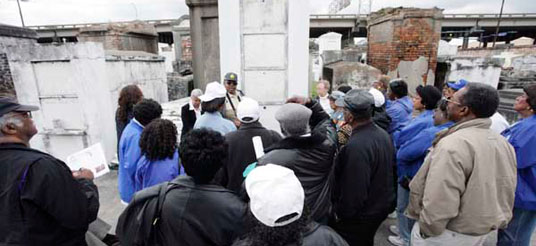 crowd of people at a cemetery in New Orleans